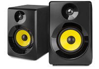 Two studio monitors with yellow woofer and silver tweeter in a glossy black speaker housing.