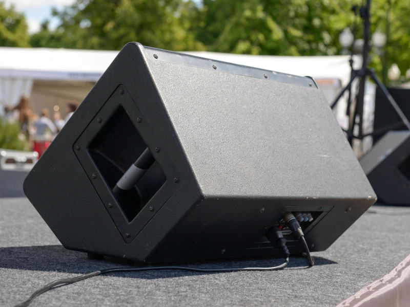 A Guide to Stage Monitor Speakers - Active Floor Monitor Wedge Speaker on a Stage